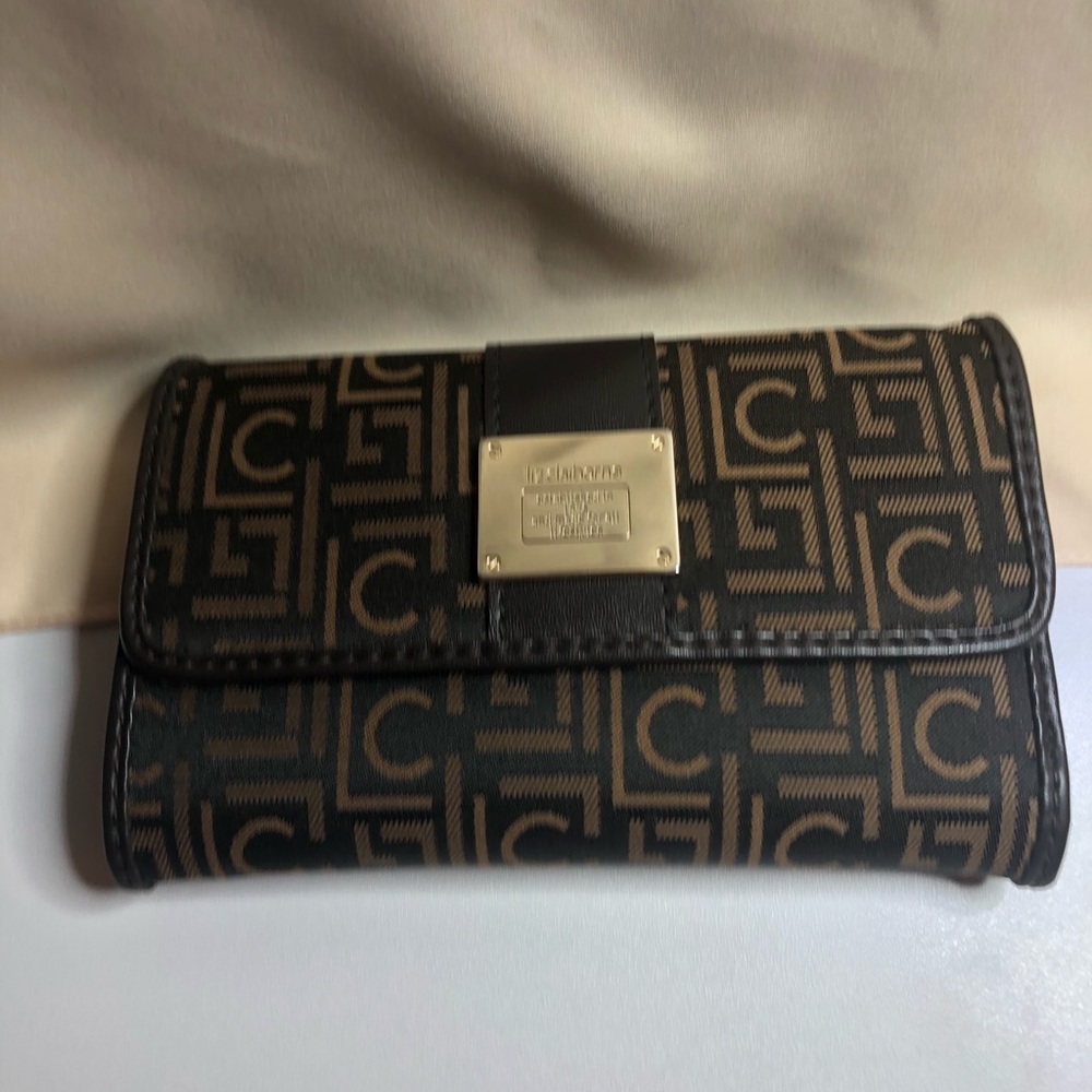 FREE W/purchase of $50 and up! 
Liz Claiborne Compact Wallet